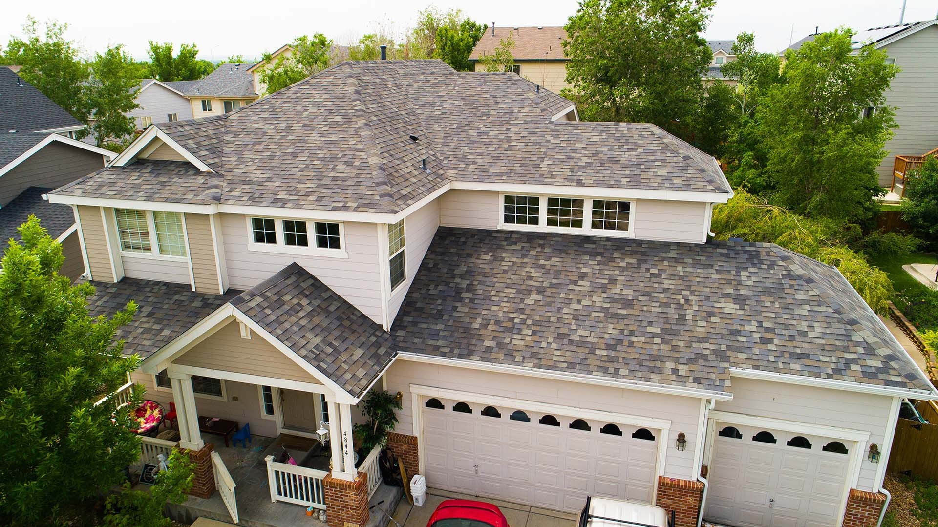 Large house asphalt shingle roofing installed by Northern Lights Exteriors
