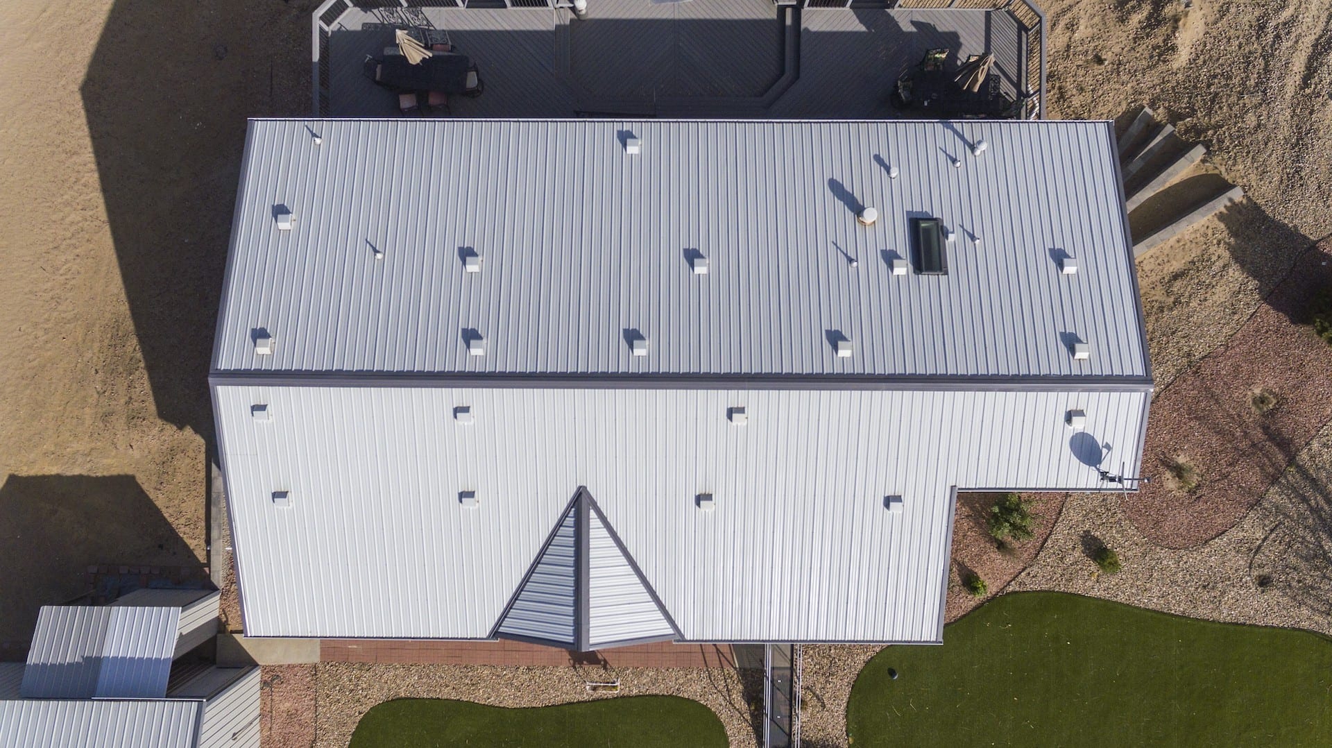 Exposed Fastener metal roofing on commercial building by Northern Lights Exteriors