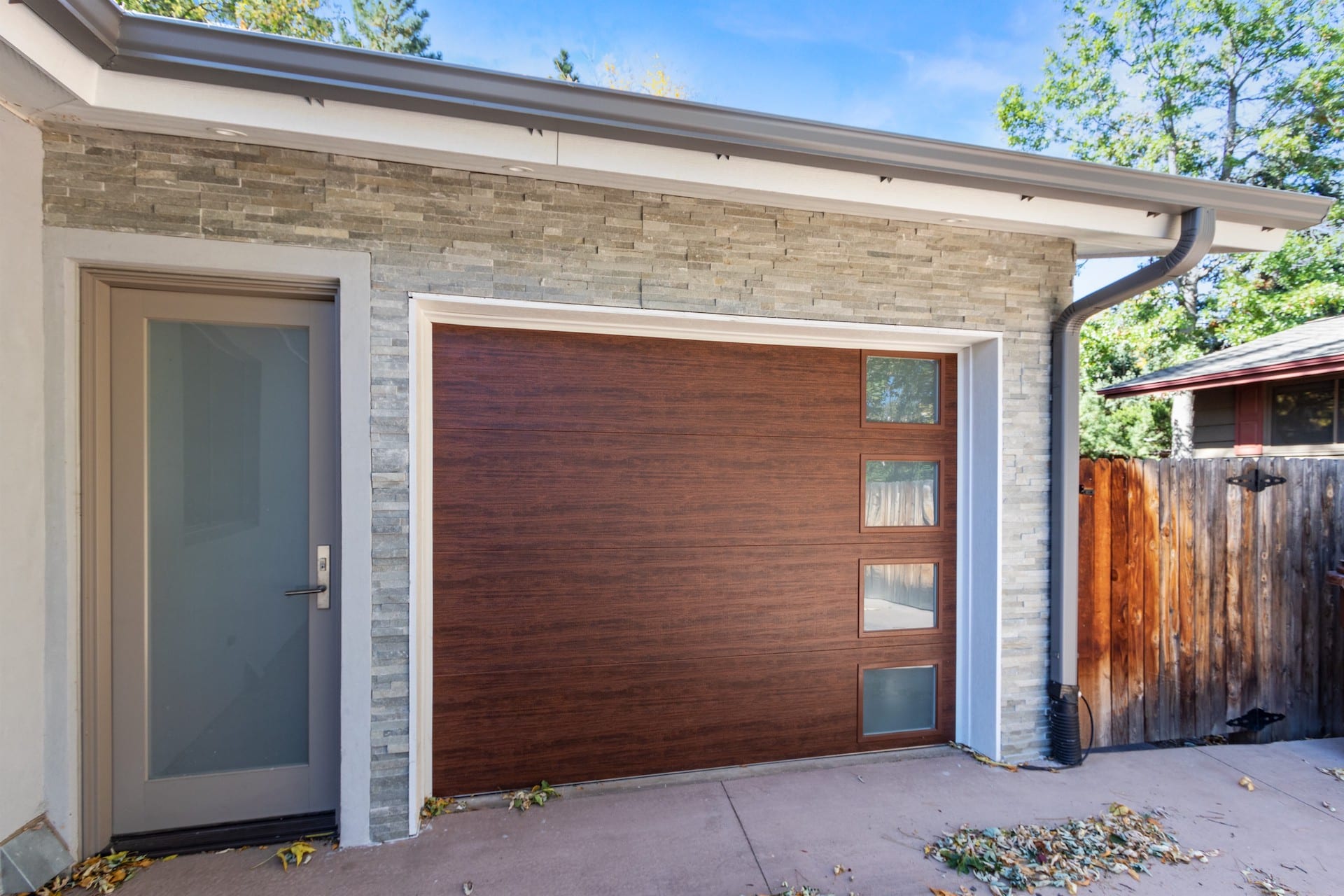 Stone Veneer Siding - Garage Door Accent installed by Northern Lights Exteriors