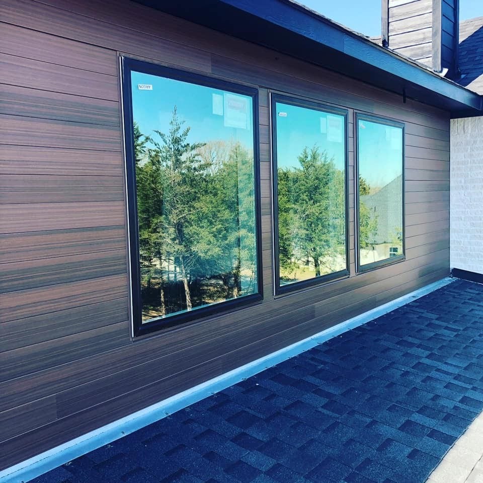 Home with wood-looking steel siding installed by Northern Lights Exteriors