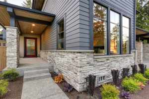 Home with James Hardie Siding and cobblestone entry way trim