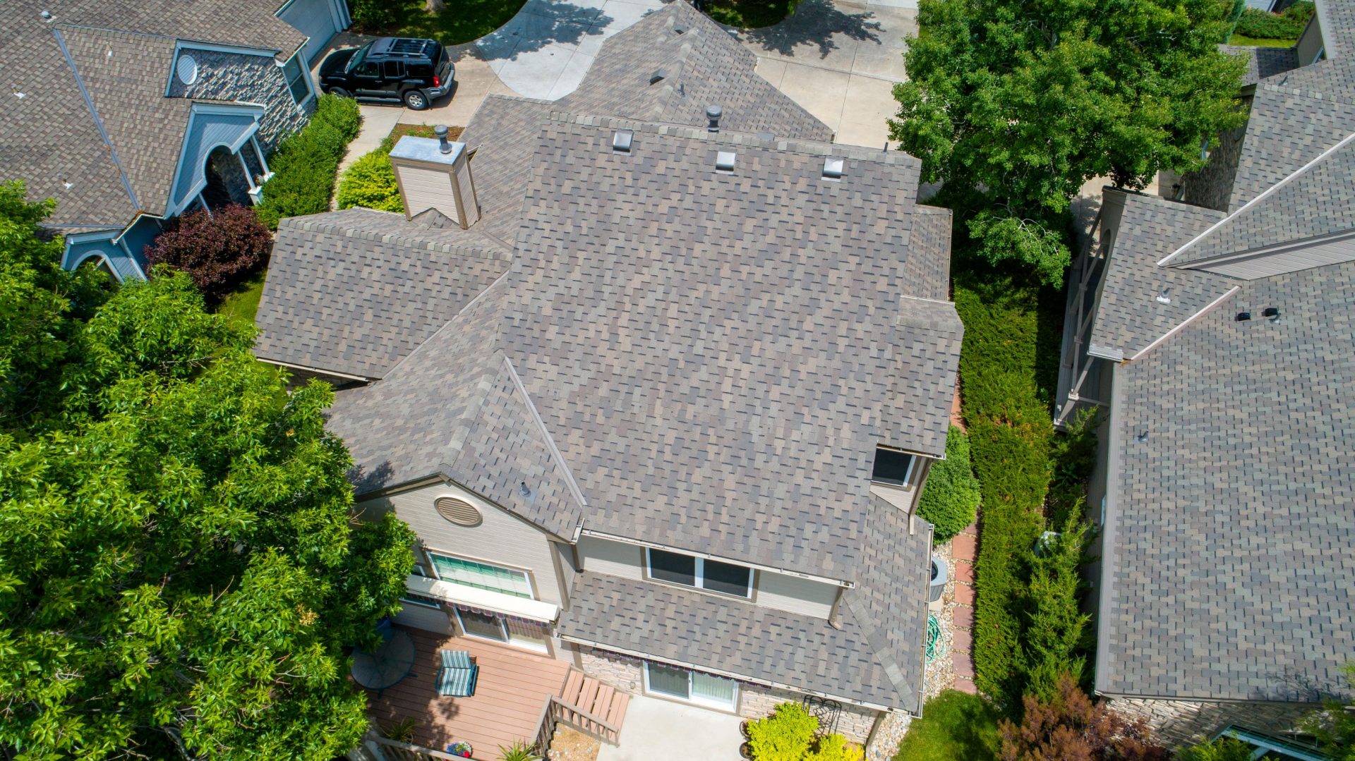 Aerial shot of large home with new roof installed by Northern Lights Exteriors