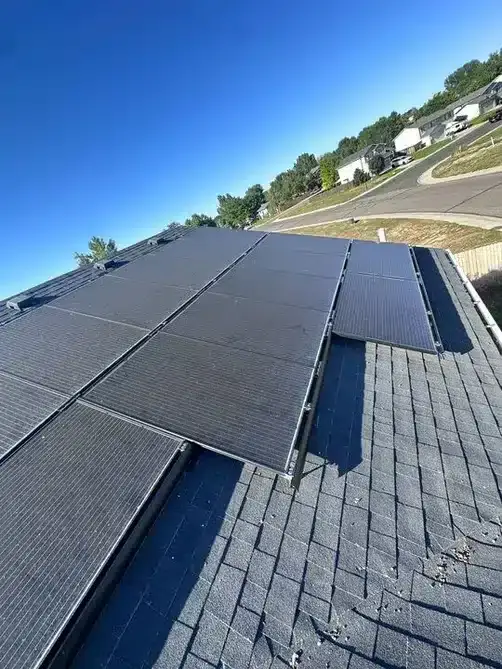 Roof replacement on a Frederick, Colorado home carrying rooftop solar &mdash; the panels are detached and reset as part of the job.
