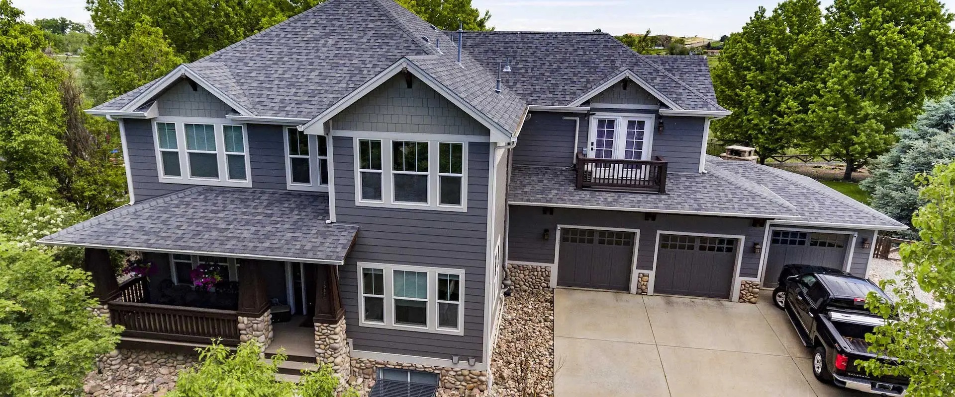 Aerial view of large home featuring installation by a leading window companies Denver | Northern Lights Exteriors