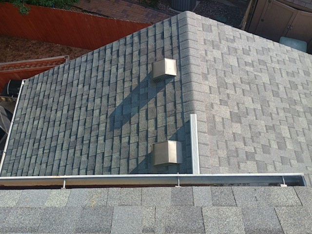 Westminster roof replacement after hail damage with new asphalt shingles.