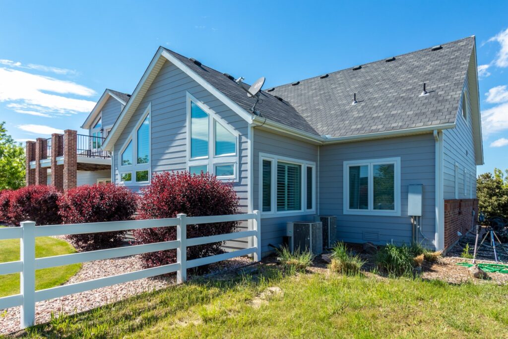 Brighton siding replacement with James Hardie Pearl Gray siding and Arctic White trim installed by Northern Lights Exteriors