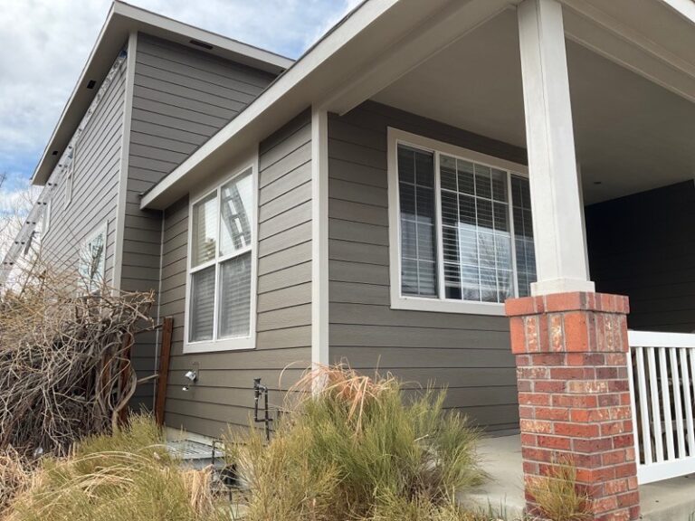 Golden, CO home with James Hardie siding in Timberbark, Cobblestone trim and new windows by Northern Lights Exteriors