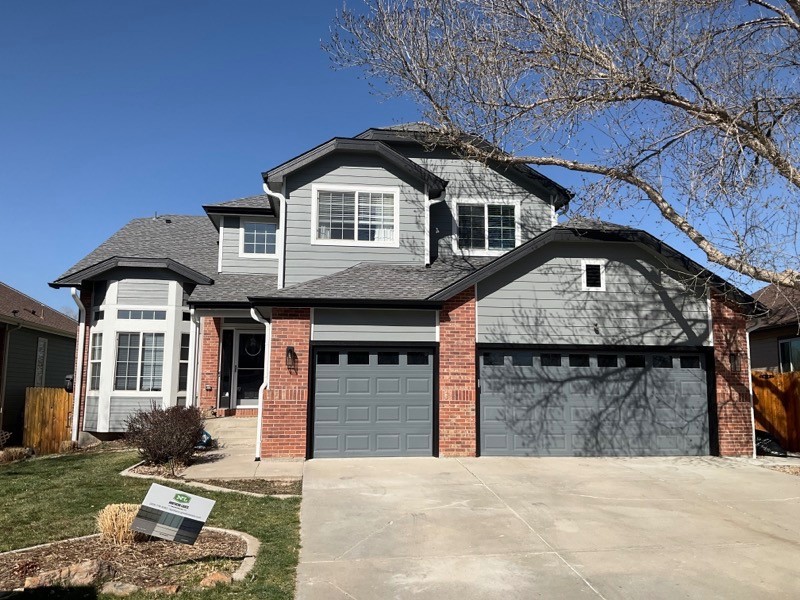 Thornton home with James Hardie Gray Slate siding and Arctic White trim installed by Northern Lights Exteriors