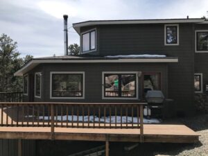 Nederland Siding Replacement in Class-A fire rated siding James Hardie Timberbark with Cobblestone Trim