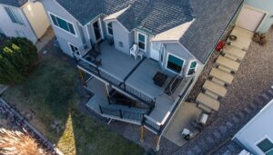 "Milliken home with new composite deck installation featuring modern railings and outdoor living space."