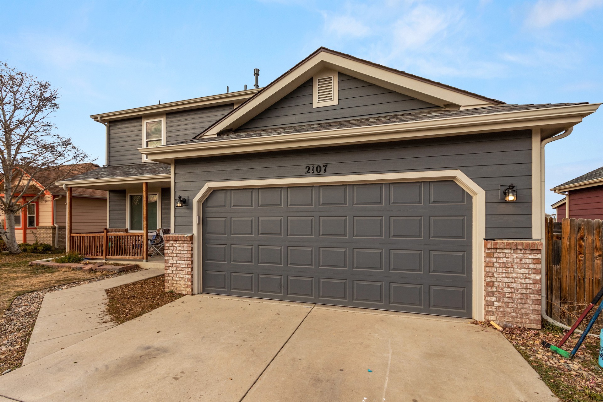 Johnstown home with James Hardie lap siding in Night Gray and light trim for a bold, modern exterior remodel.