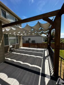 Composite deck with pergola installed in Longmont Colorado