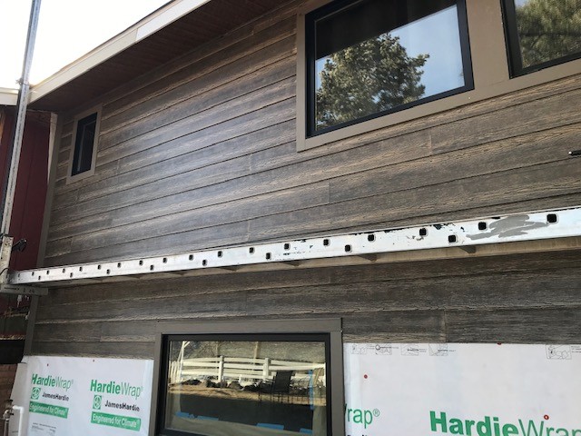 Golden, CO home remodel with James Hardie WoodTone River Rock siding by Northern Lights Exteriors