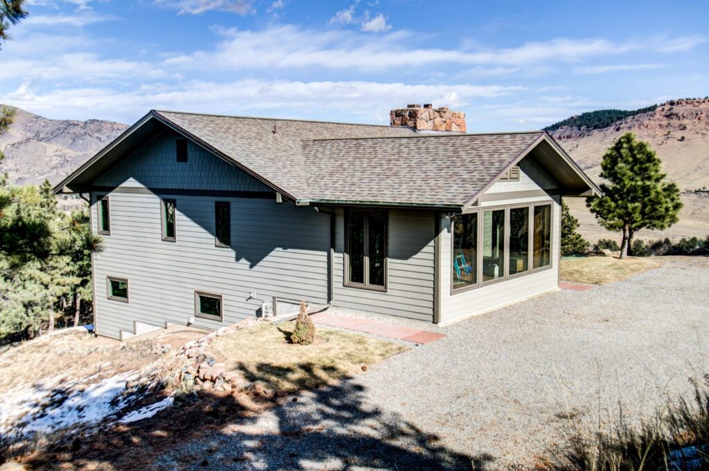 Lyons home with James Hardie Monterey Taupe siding and Timberbark trim installed by Northern Lights Exteriors