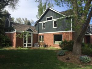 Fort Collins home with James Hardie Iron Gray siding, Arctic White trim, and roof replacement