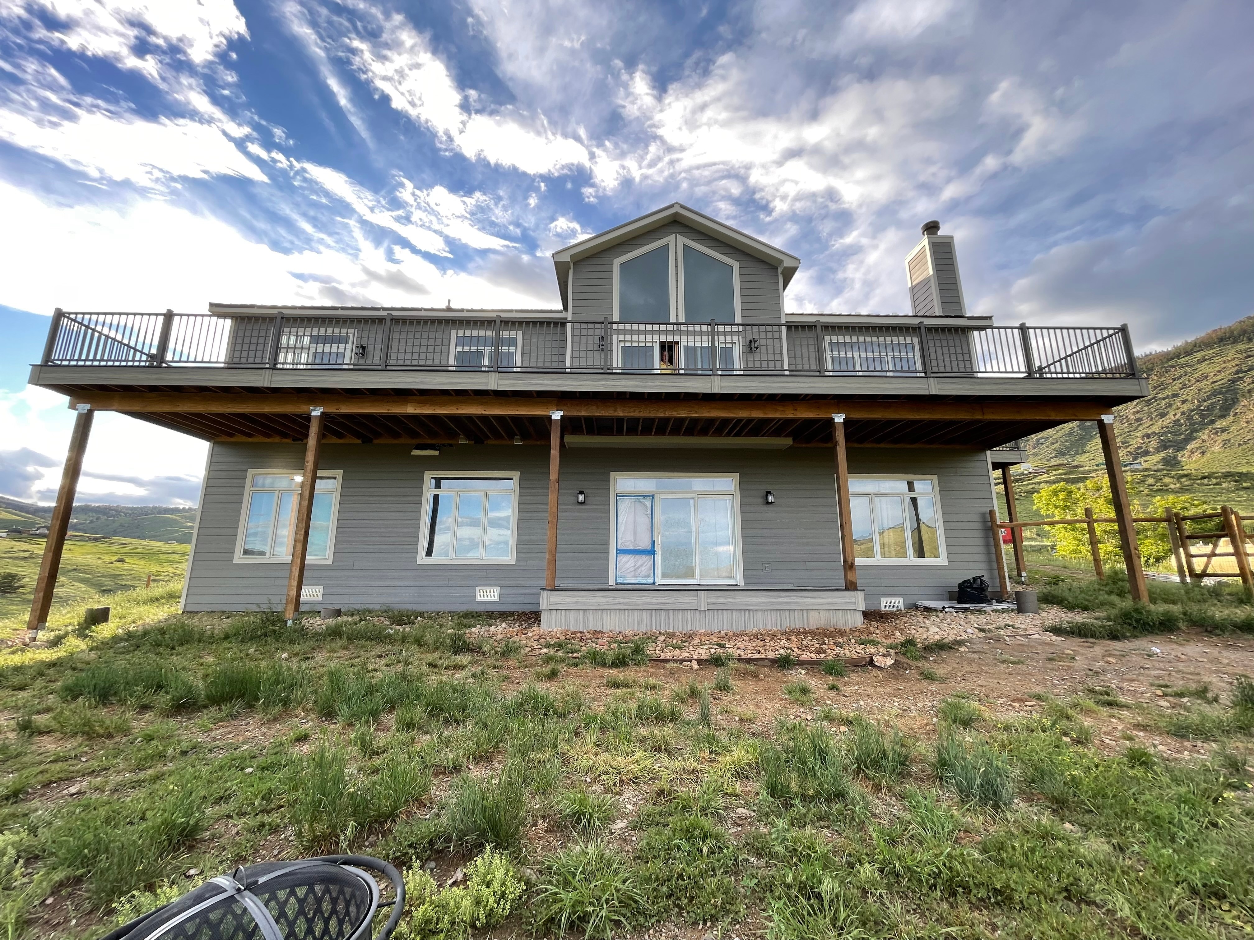 Loveland exterior remodel with James Hardie siding, new windows and doors, and a composite deck
