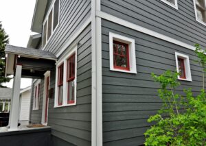 Longmont home featuring James Hardie Iron Gray siding with Arctic White trim installed by Northern Lights Exteriors