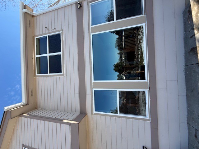 Wood-clad replacement windows installed on a nearby north metro home by Northern Lights Exteriors