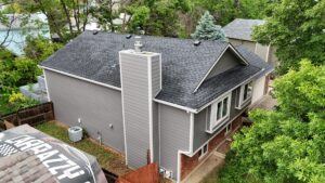 Longmont home with new James Hardie siding in gray with white trim installed by Northern Lights Exteriors