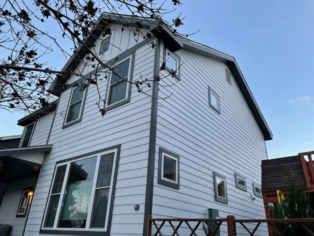 Nearby Denver project with James Hardie Arctic White lap siding and Iron Gray trim by Northern Lights Exteriors
