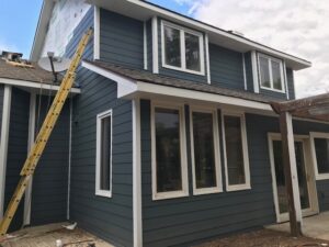Windsor, Colorado home with James Hardie Evening Blue siding and Arctic White trim installed by Northern Lights Exteriors.