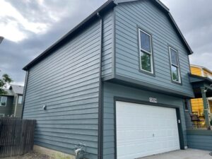 Brighton, CO home with James Hardie Boothbay Blue siding and Iron Gray trim by Northern Lights Exteriors.