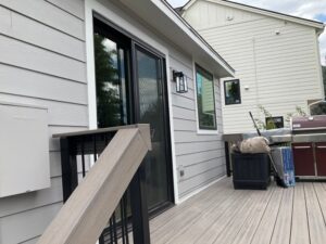 Windsor, Colorado home featuring James Hardie Pearl Gray siding with Arctic White trim installed by Northern Lights Exteriors.