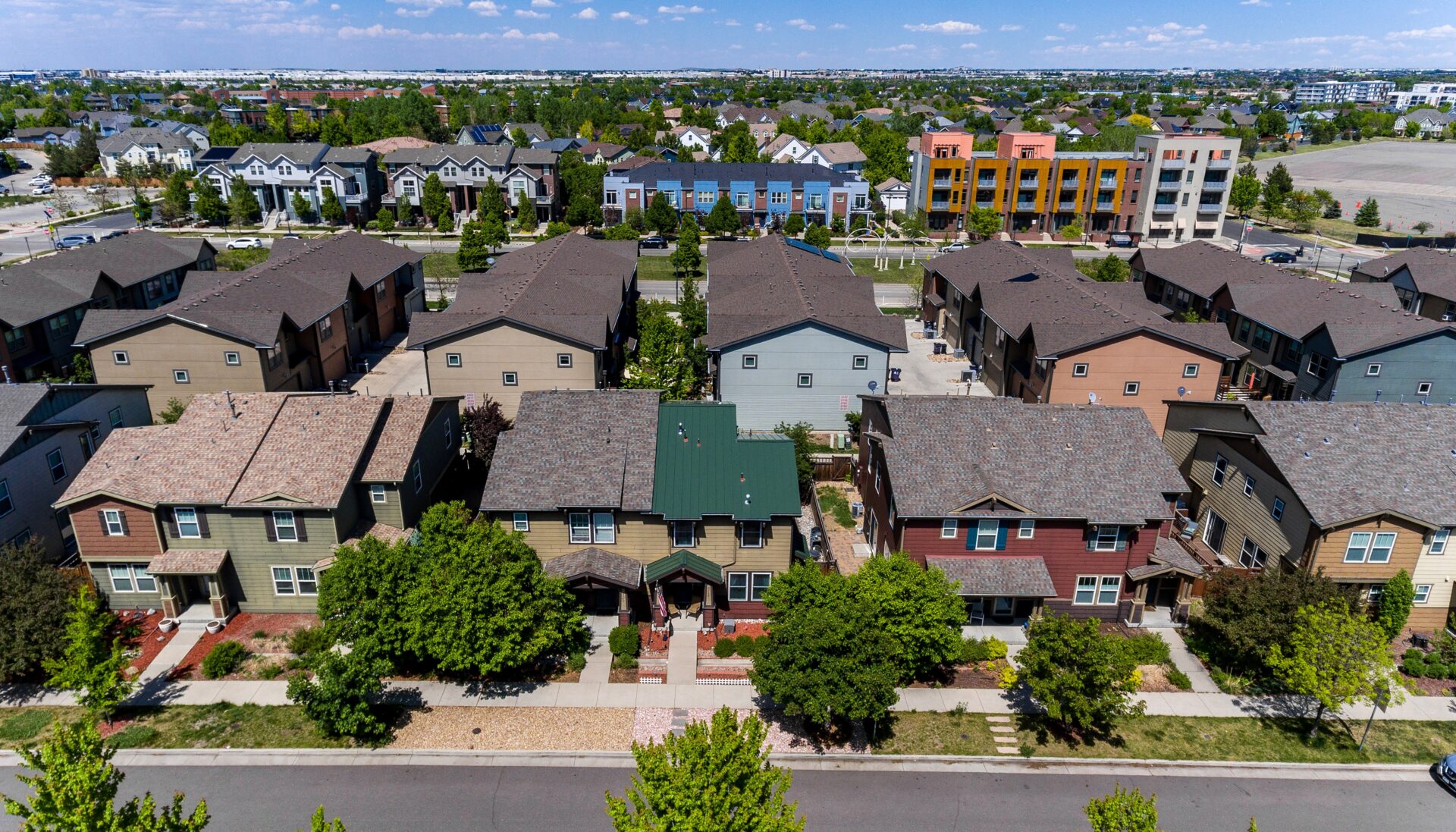 Denver home with new metal roof and twelve Pella Impervia fiberglass replacement windows installed by Northern Lights Exteriors.
