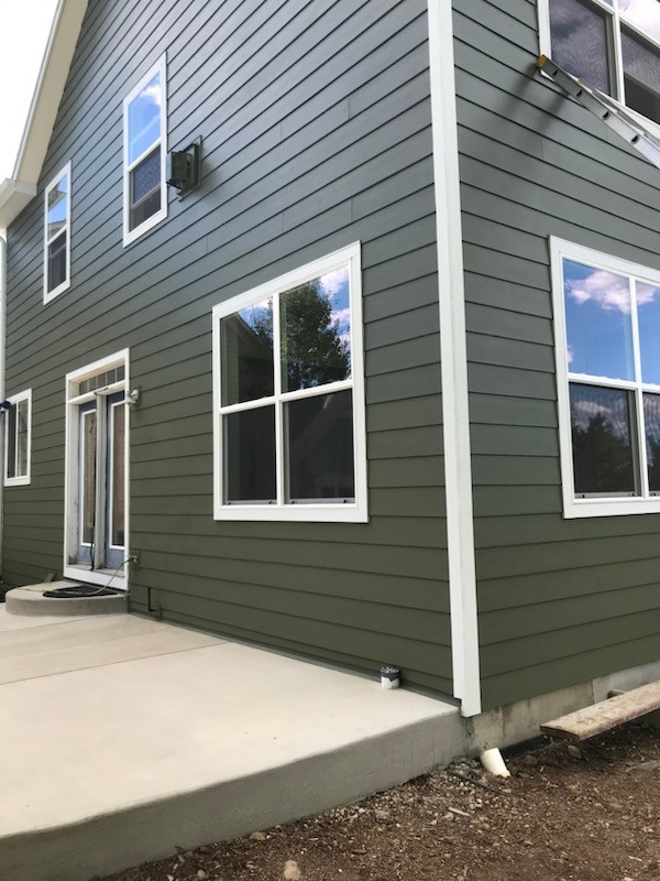 Lafayette home with James Hardie Mountain Sage siding installed by Northern Lights Exteriors