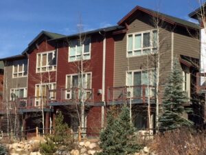 Fraser James Hardie® Multi-Family/Multi-Building Class-A Siding Replacement - Monterey Taupe, Countrylane Red with Shingled Accents and Navajo Beige Trim