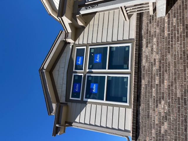 Nearby Brighton home with energy-efficient replacement windows installed by Northern Lights Exteriors