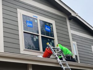 Greeley home restored after hail damage with new Anlin vinyl windows installed as part of a multi-trade exterior restoration by Northern Lights Exteriors.