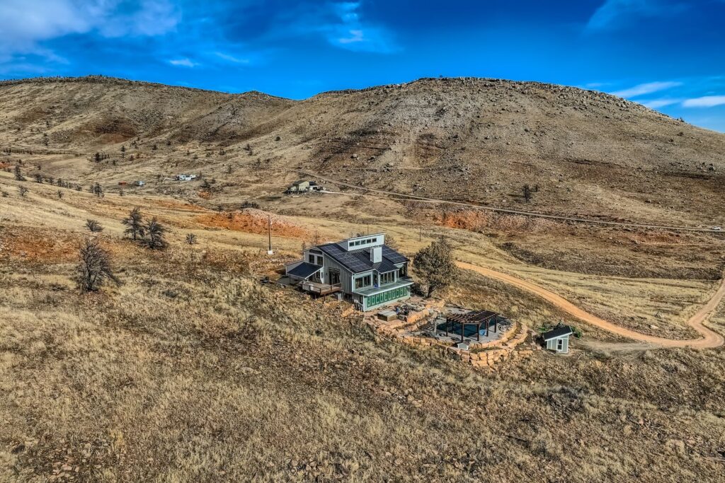 Lyons, CO home with James Hardie siding and fire-conscious design standing in a burned landscape after the Stone Canyon Fire.