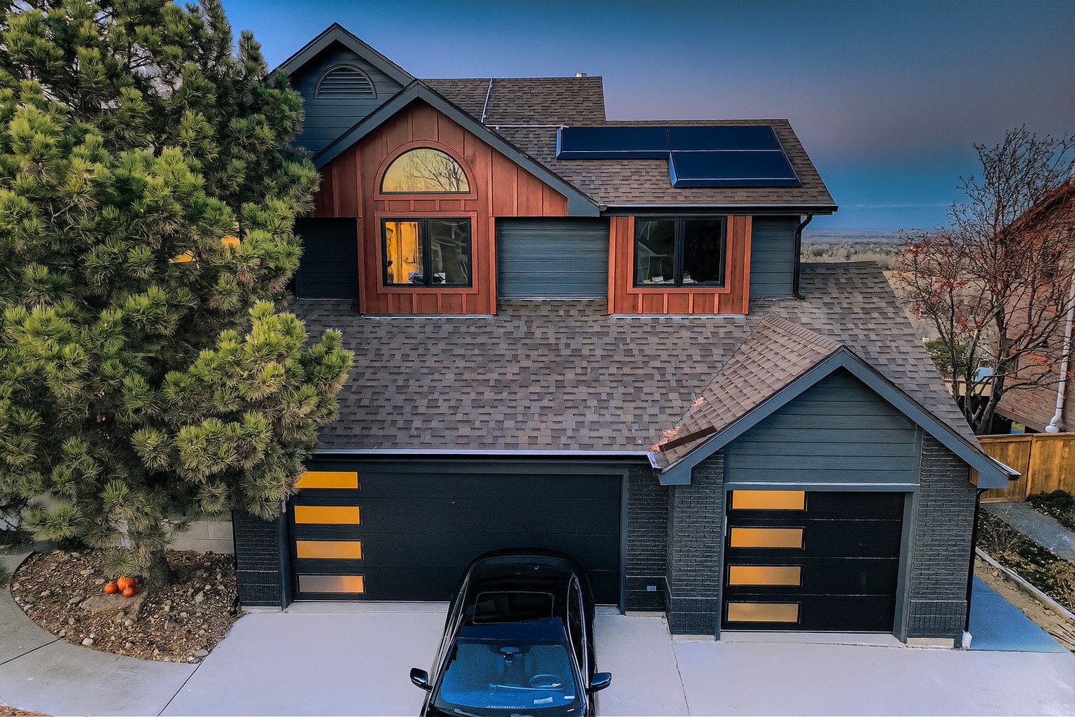 James Hardie WoodTone siding with modern wood accents on a Colorado house exterior by Northern Lights Exteriors