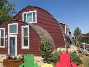 Countrylane Red James Hardie siding on a Longmont Colorado home exterior remodel by Northern Lights Exteriors