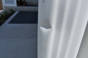dented roof vent from hail storm damage