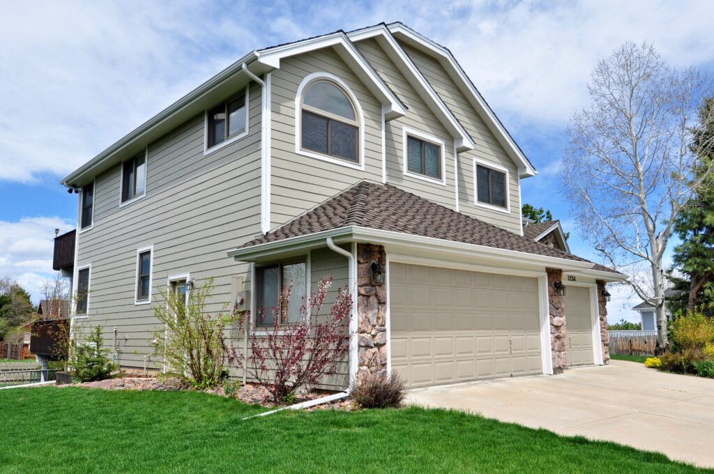 Louisville exterior remodel with siding, windows and doors, and a composite deck