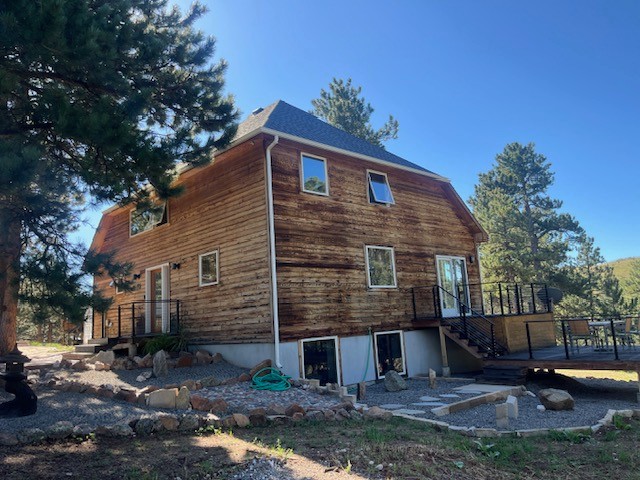 Before view of a Boulder CO home before James Hardie Woodtone fire-rated siding installation