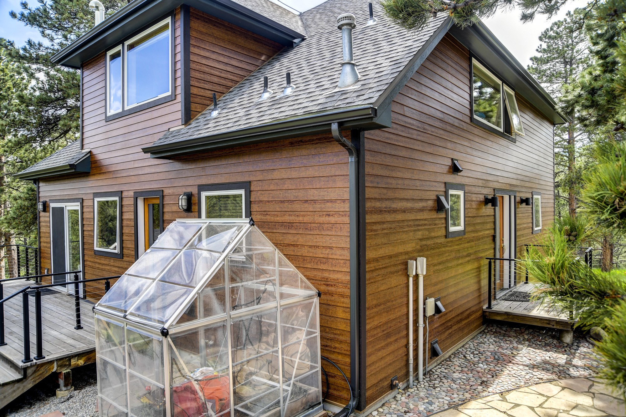 After photo of a Boulder CO home with James Hardie Woodtone fire-rated fiber cement siding installed by Northern Lights Exteriors