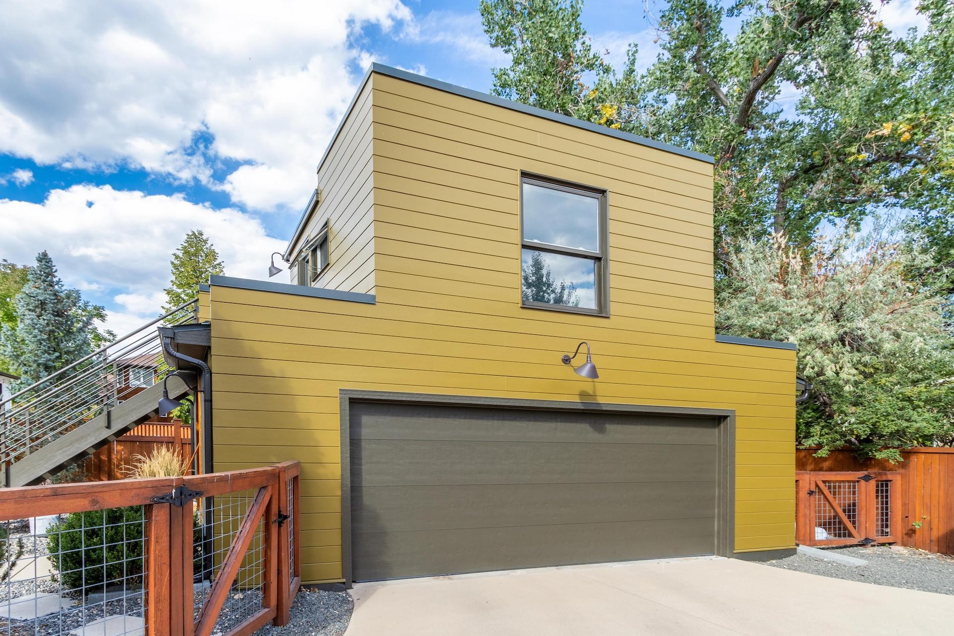North Boulder CO home with James Hardie Artisan V-Groove siding exterior paint and new gutters installed by Northern Lights Exteriors