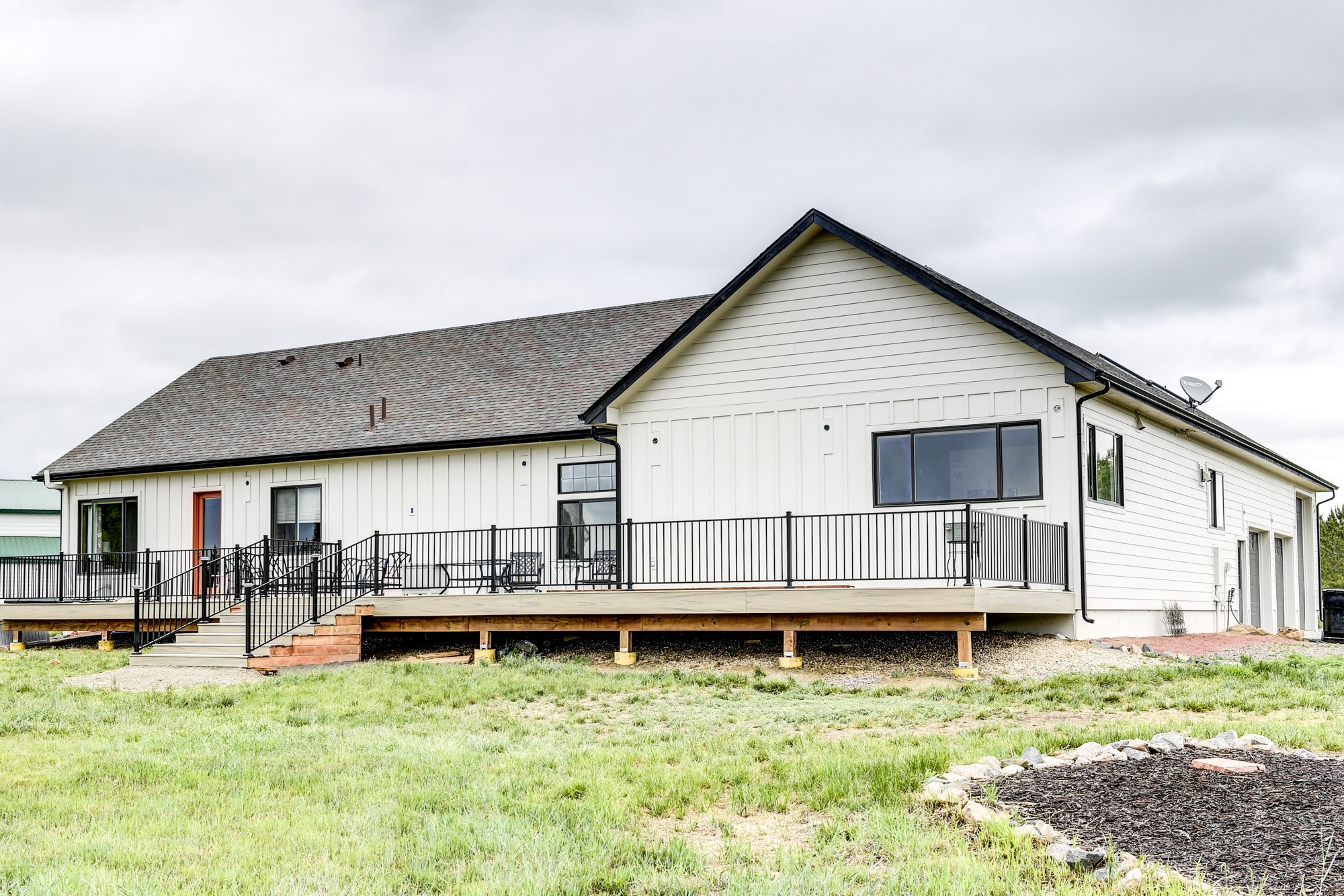 After photo of a Longmont CO home with James Hardie Cobblestone lap siding and Cobblestone trim