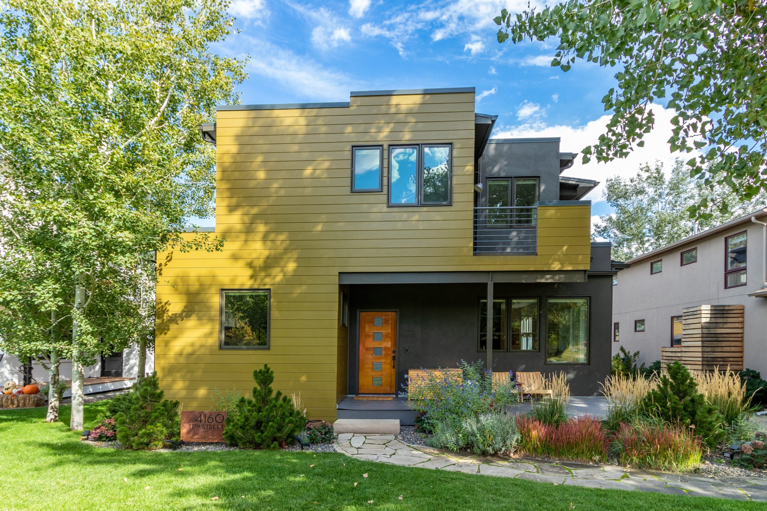 After photo of a North Boulder CO home with James Hardie Artisan V-Groove siding paint and gutters installed by Northern Lights Exteriors