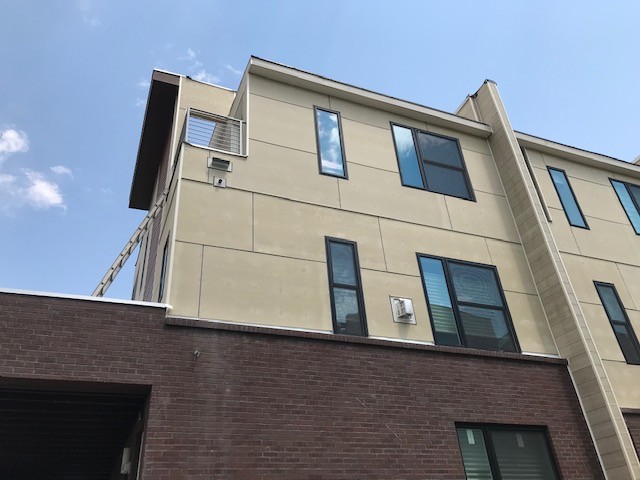 Modern exterior paint on Denver condo remodel with siding windows and roofing by Northern Lights Exteriors
