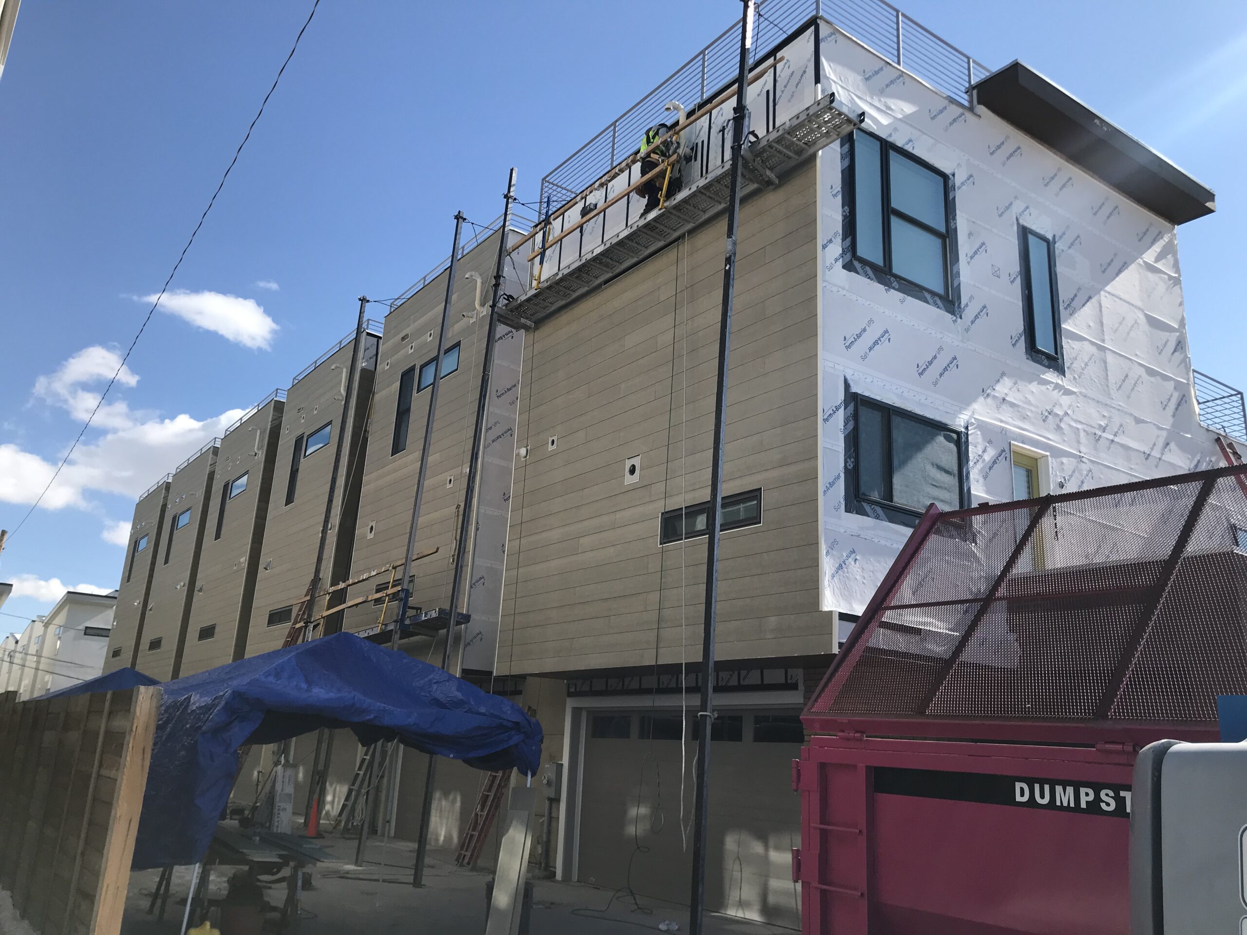 Roof coating on Denver condo commercial exterior remodel by Northern Lights Exteriors