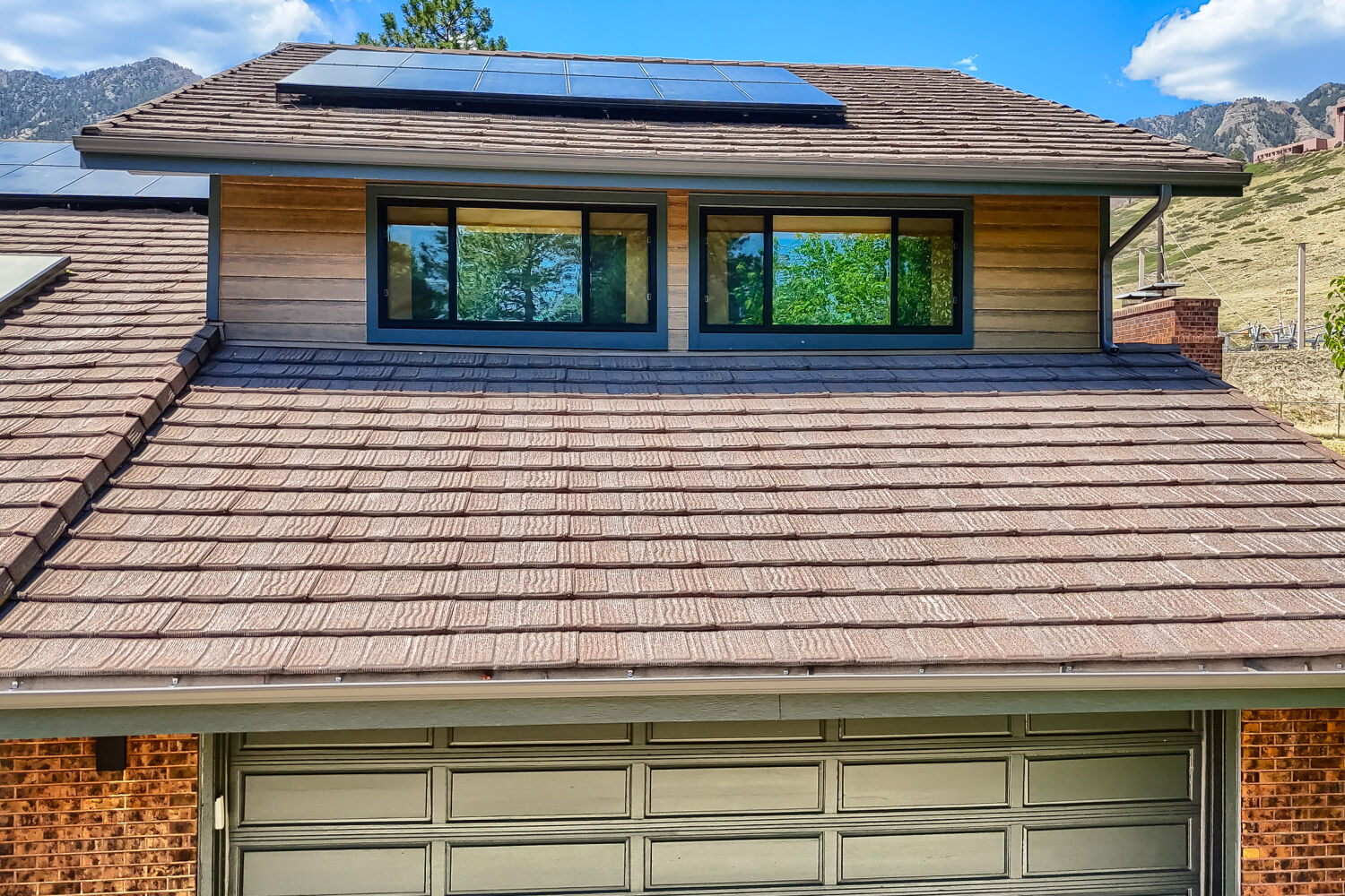 Boulder home near Chautauqua Park with close up of woodtone Aspen Ridge James Hardie siding and black Pella windows