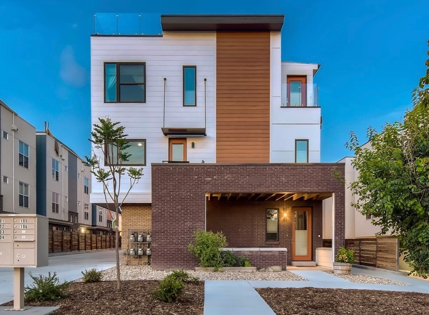 Denver condo remodel with James Hardie siding Pella windows roof coating and modern exterior paint by Northern Lights Exteriors