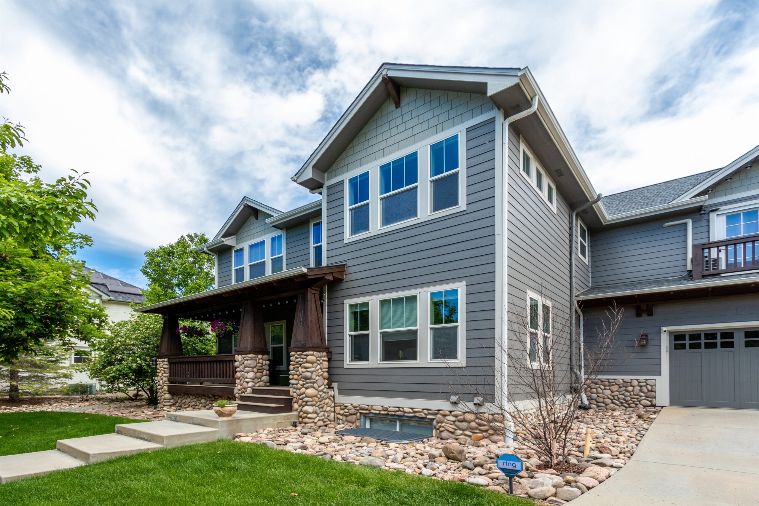 Erie exterior remodel with James Hardie Aged Pewter siding, Monterey Taupe accents, and Cobblestone trim by Northern Lights Exteriors