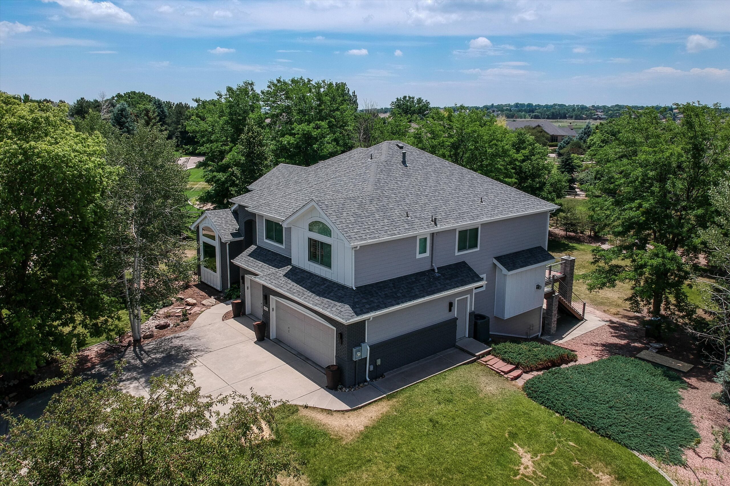 Fort Collins CO home with James Hardie Arctic White board and batten siding accents