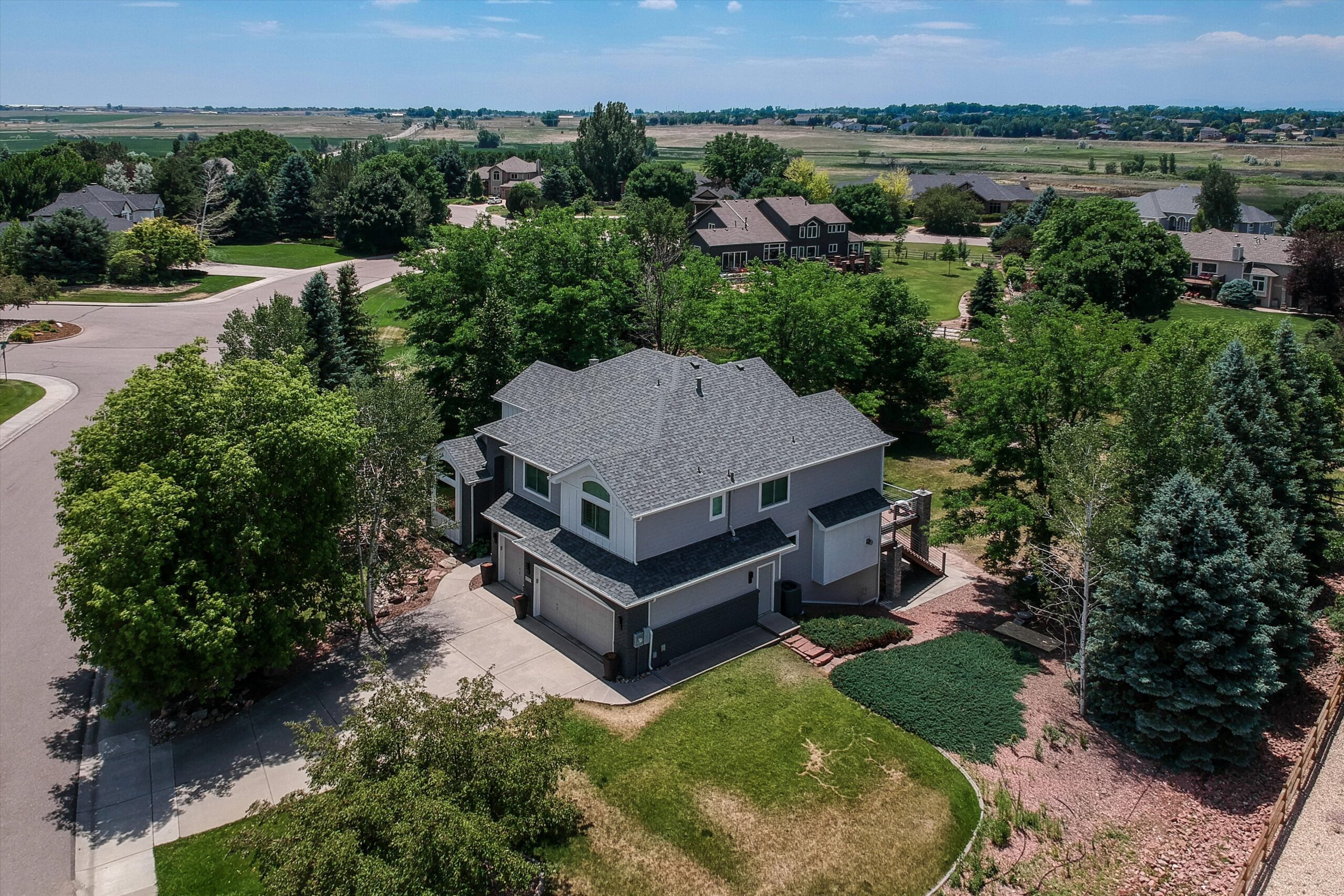 Completed Fort Collins James Hardie Pearl Gray siding replacement by Northern Lights Exteriors