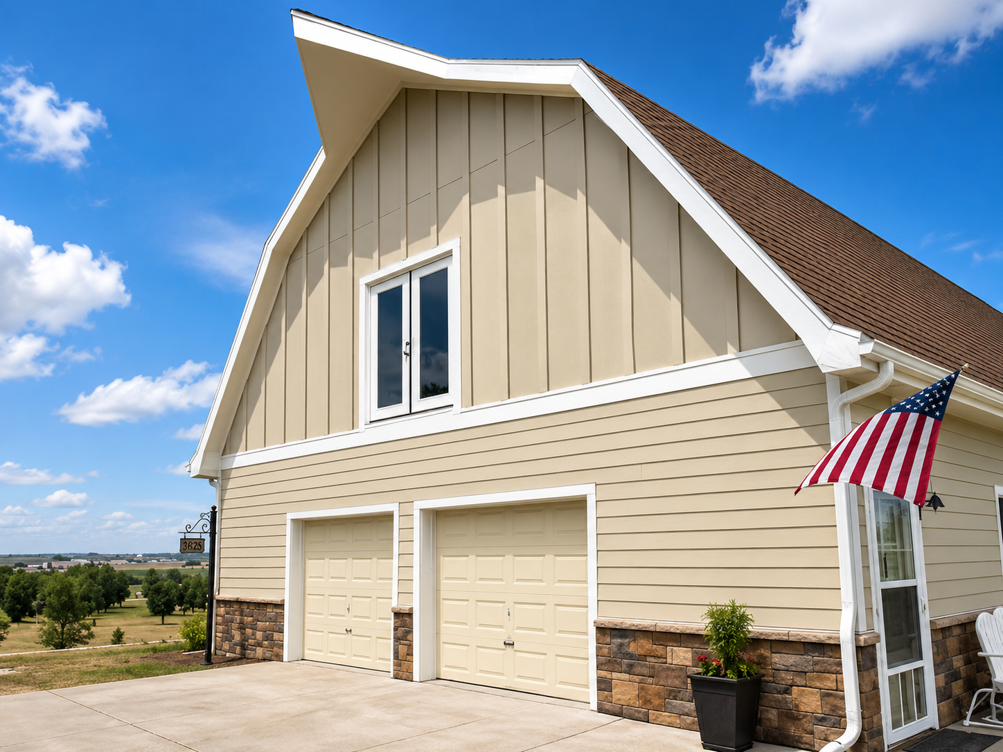 Johnstown Colorado James Hardie siding installation in Navajo Beige with Arctic White trim and vertical board and batten accents by Northern Lights Exteriors